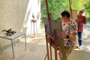 Learn how to paint behind an easel in France